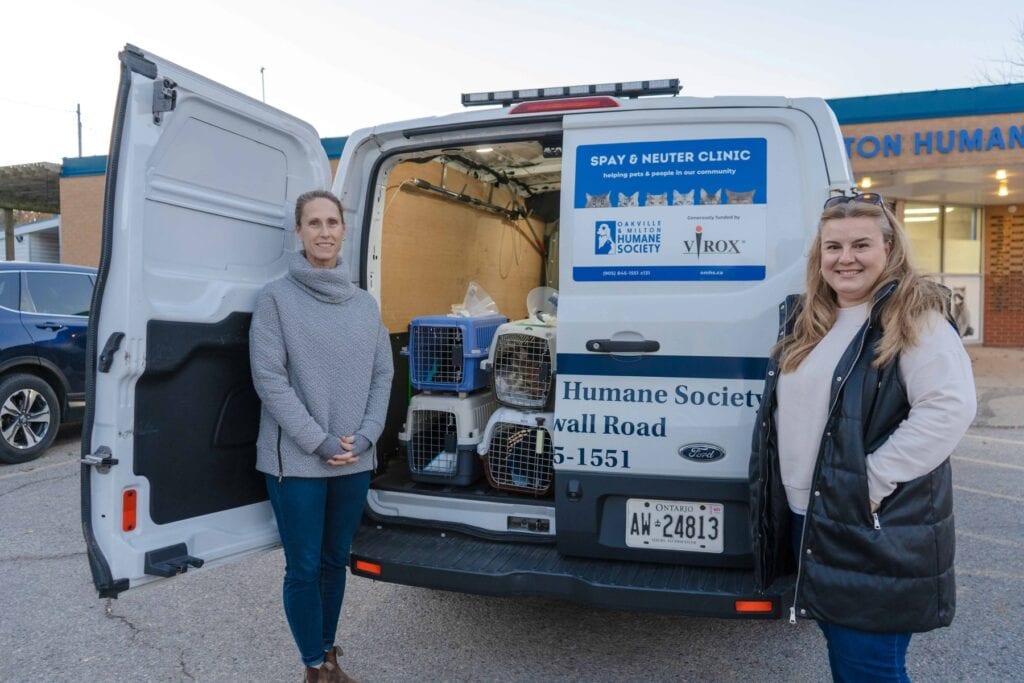 OMHS and Virox representatives standing in front of a white OMHS van.