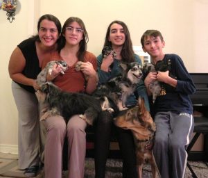 A family portrait of the Do Rego family and their current fosters.