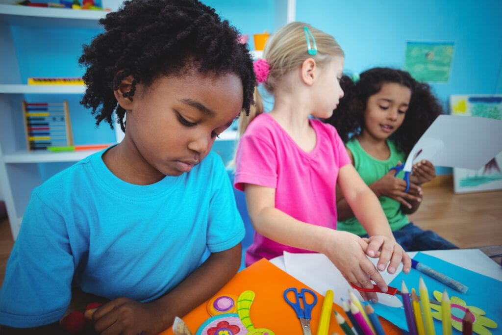 Happy kids using modelling clay together