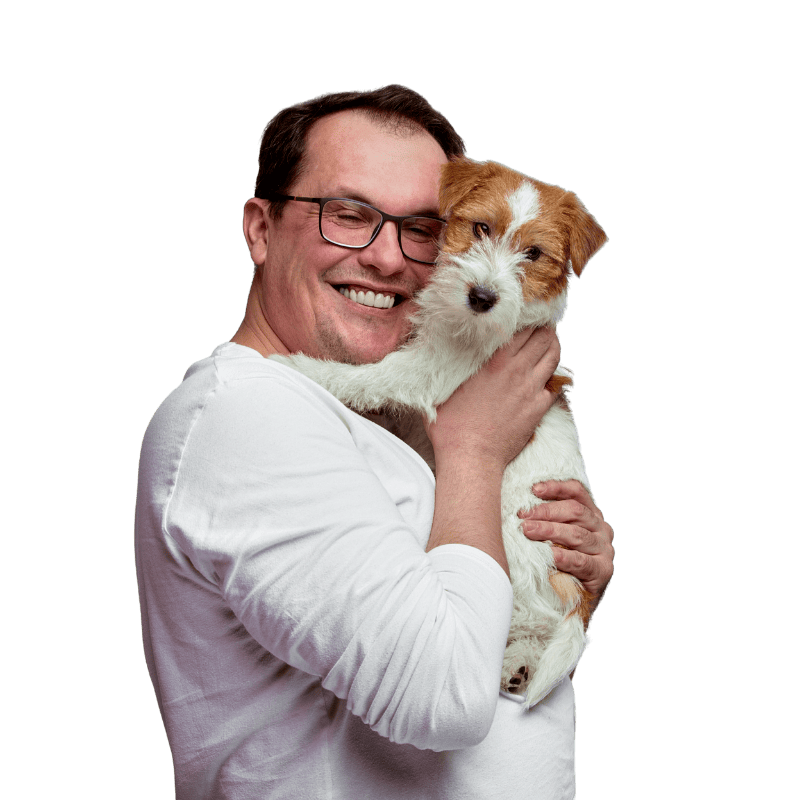 happy man holding small dog