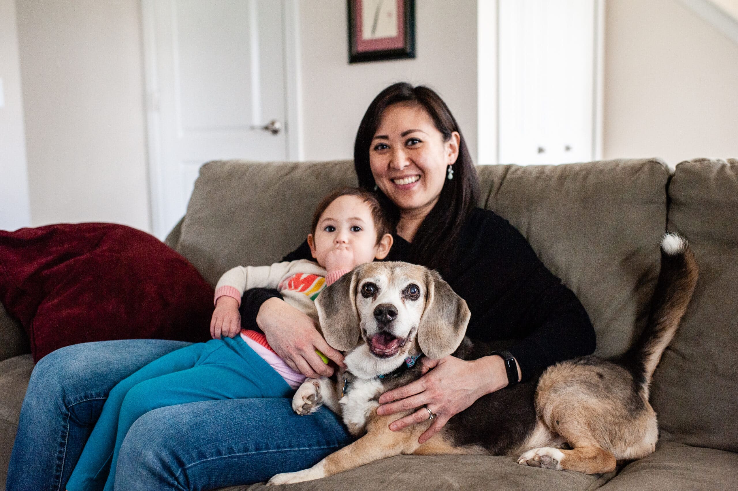woman baby happy beagle couch
