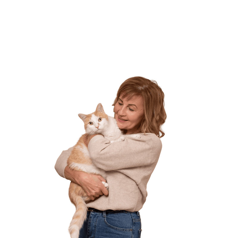 woman holding white and orange cat smiling